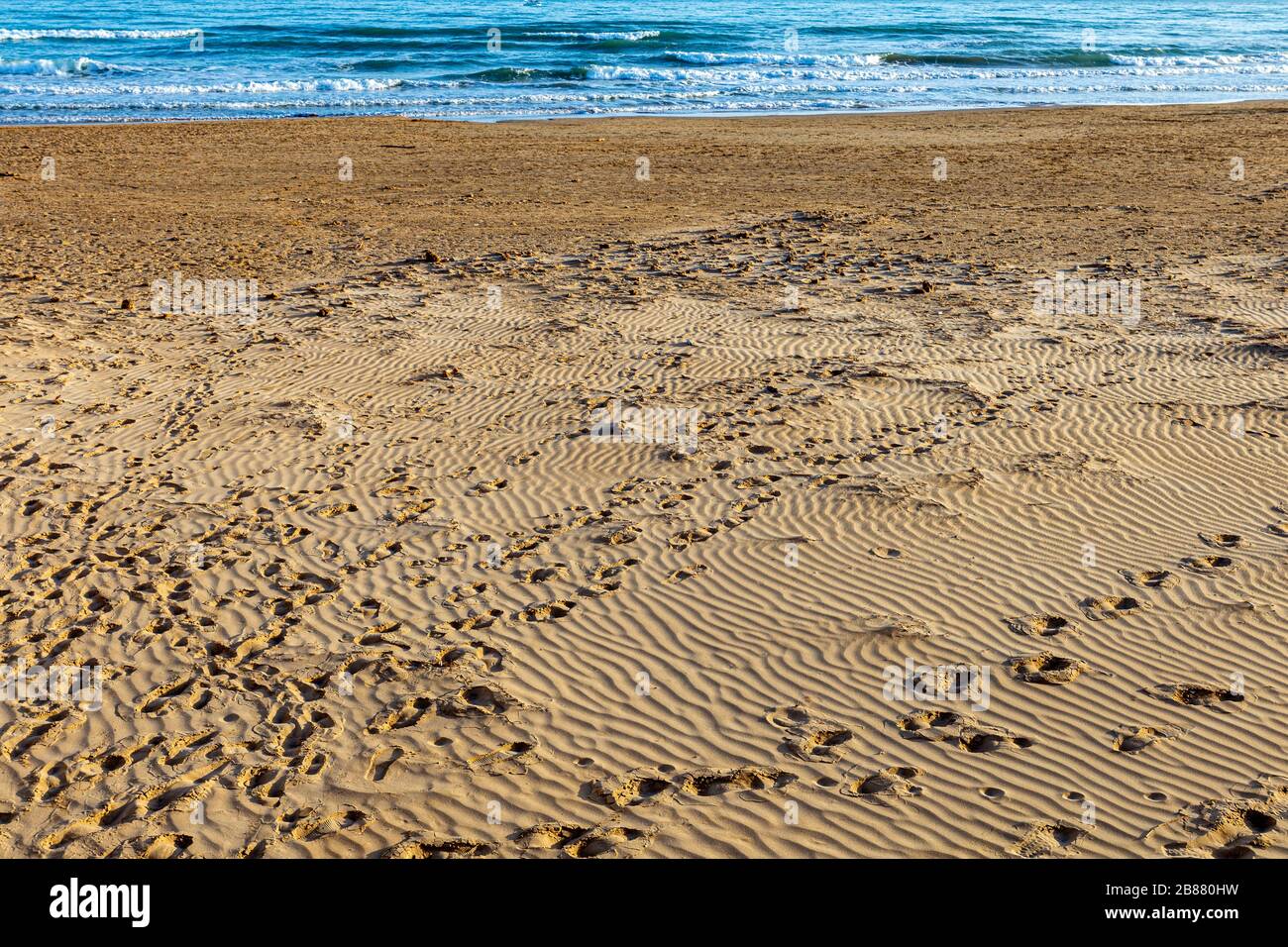 Beautiful Sicilian beach with golden sand with a blue sea Stock Photo