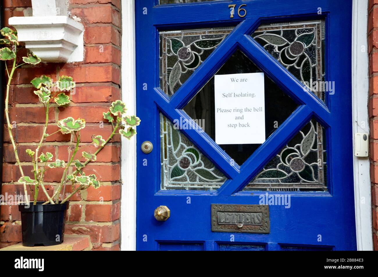 note on door tells visitors the occupants are self isolating in highgate london UK england Stock Photo
