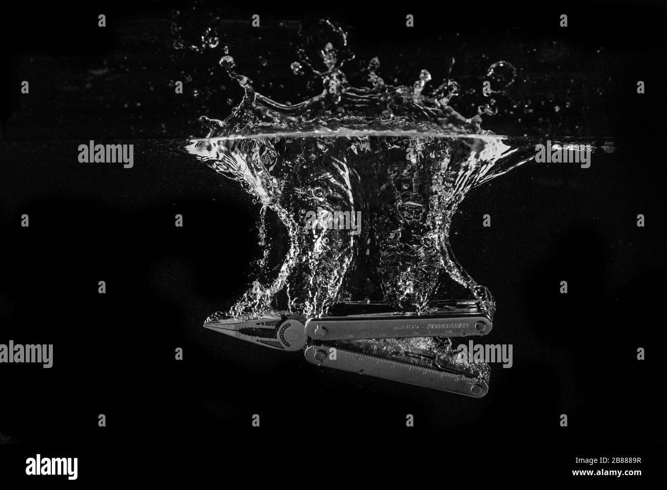 Leatherman Multitool Dropped in Water Stock Photo