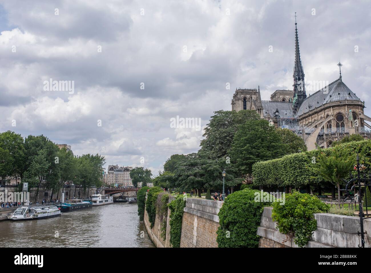 Notre Dame cathedral and Seine river in Paris, France. Dark heaven. Notre Dame view before fire. Travel locations in France, Europe Stock Photo