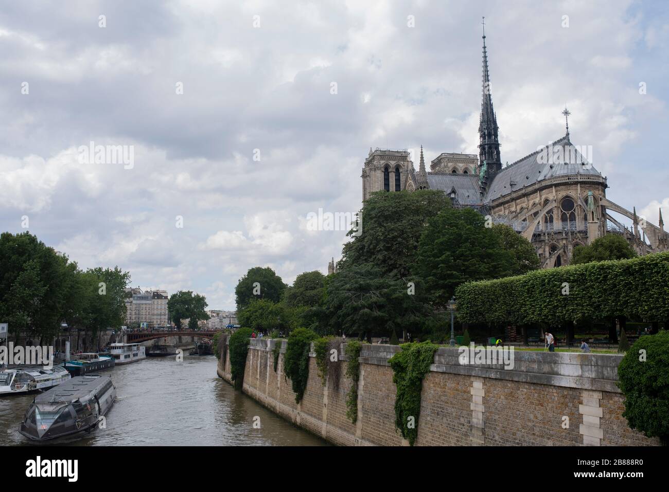 Notre Dame cathedral and Seine river in Paris, France. Dark heaven. Notre Dame view before fire. Travel locations in France, Europe Stock Photo