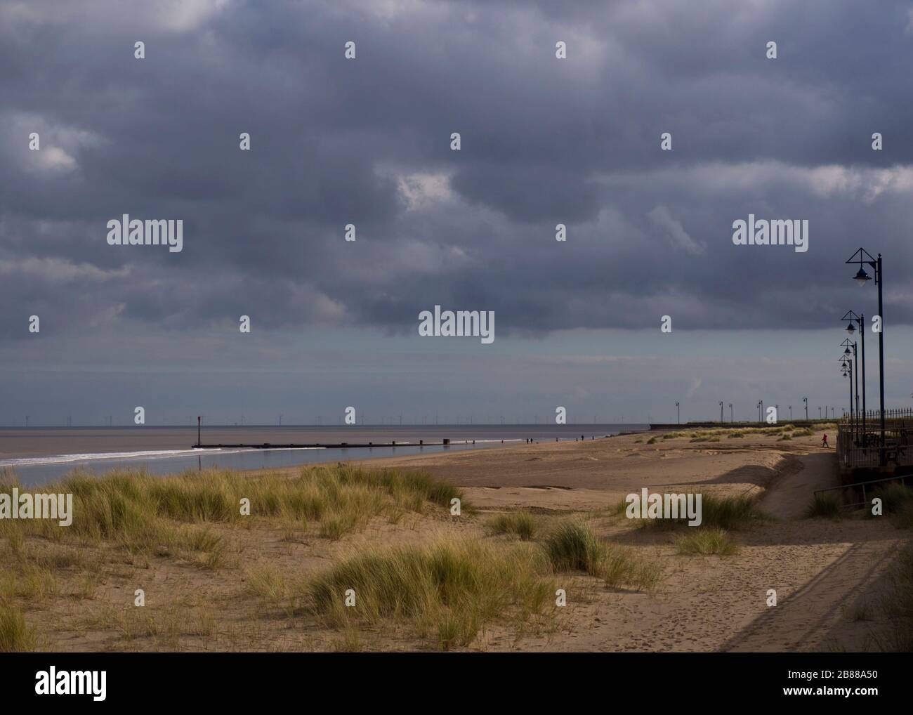 Grey skies over the beach at Maplethorpe in march, Lincolnshire, UK Stock Photo