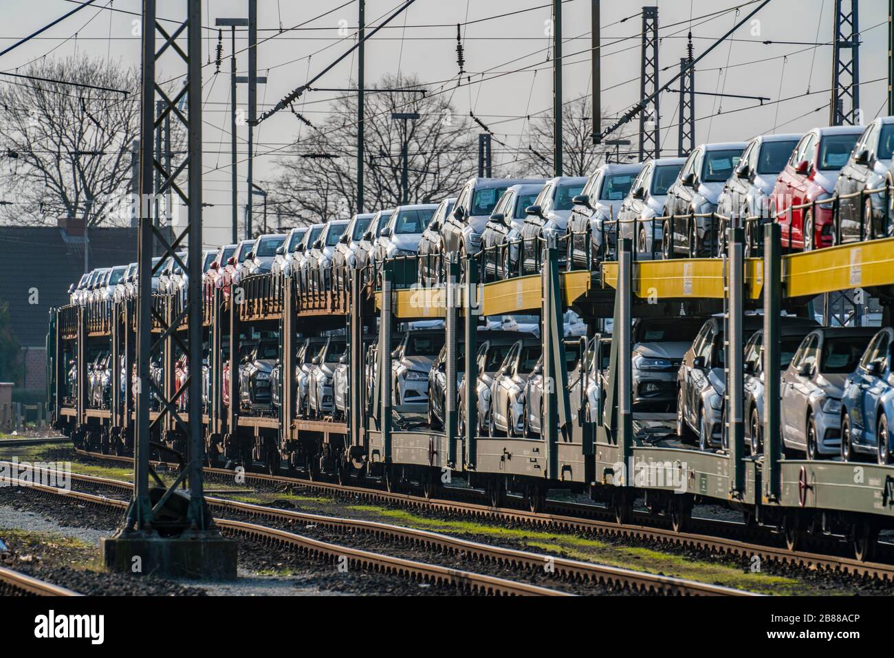 VW factory, Emden, new cars, car transporter, car train, freight train, with VW vehicles, Lower Saxony, Germany, Stock Photo