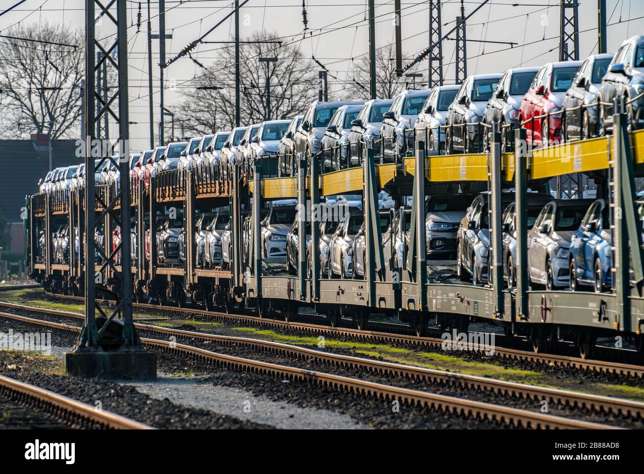 VW factory, Emden, new cars, car transporter, car train, freight train, with VW vehicles, Lower Saxony, Germany, Stock Photo