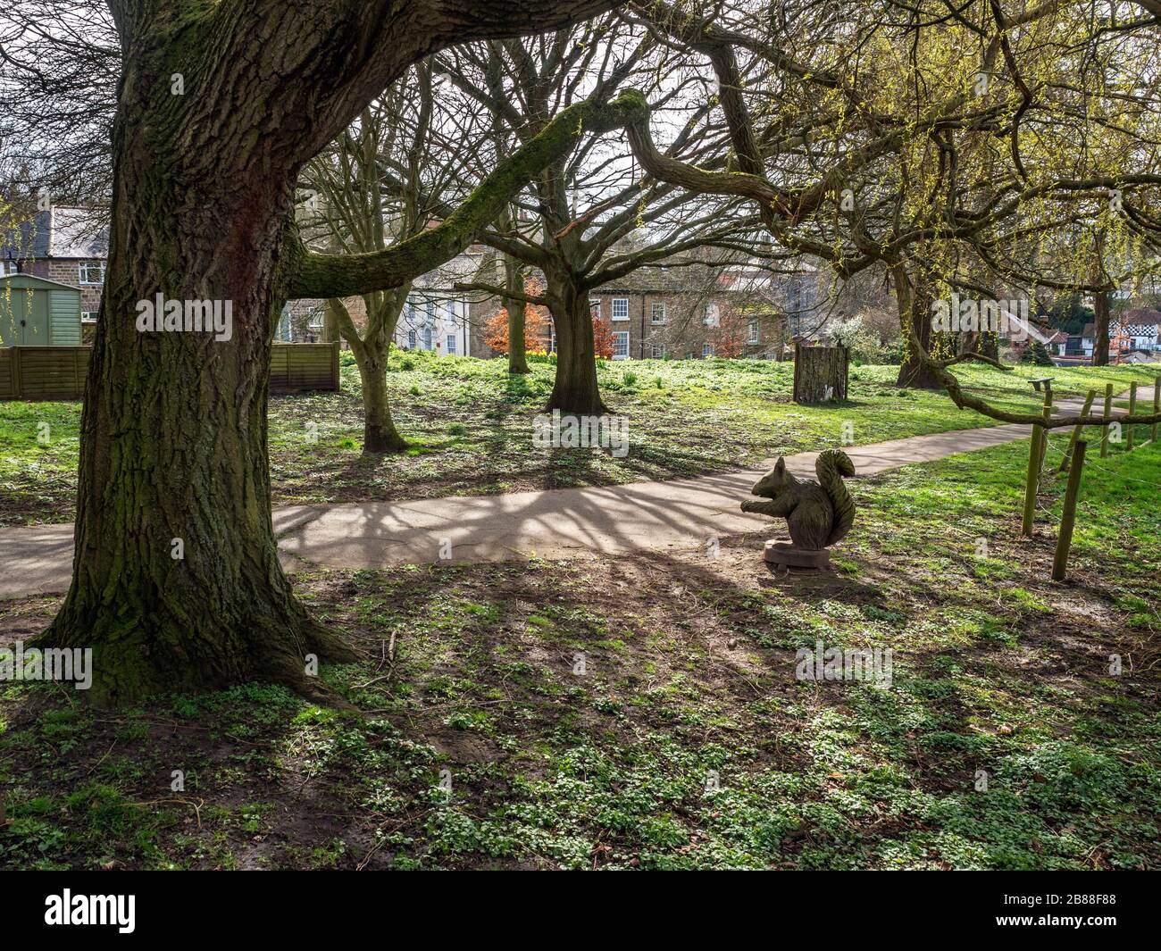 Sculpture trail with wood carved sculptures in spring at Knaresborough North Yorkshire England Stock Photo