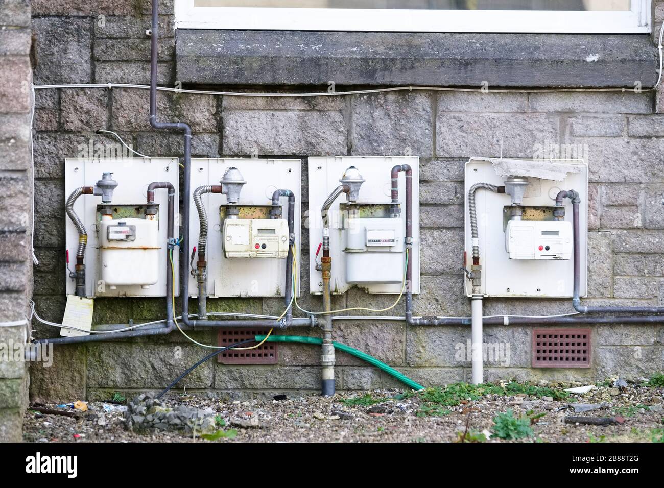 Gas meter box housing outside external to council house a row Stock Photo