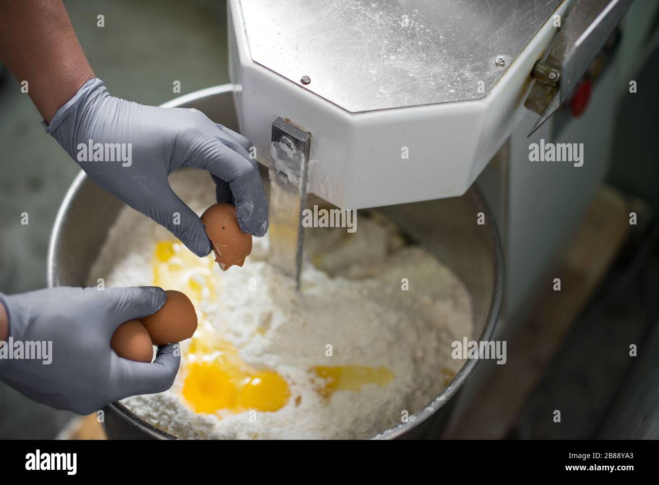 Bread Mixer In Bakery, mixing dough for baguettes in a bakery machine for  mixing dough Stock Photo - Alamy