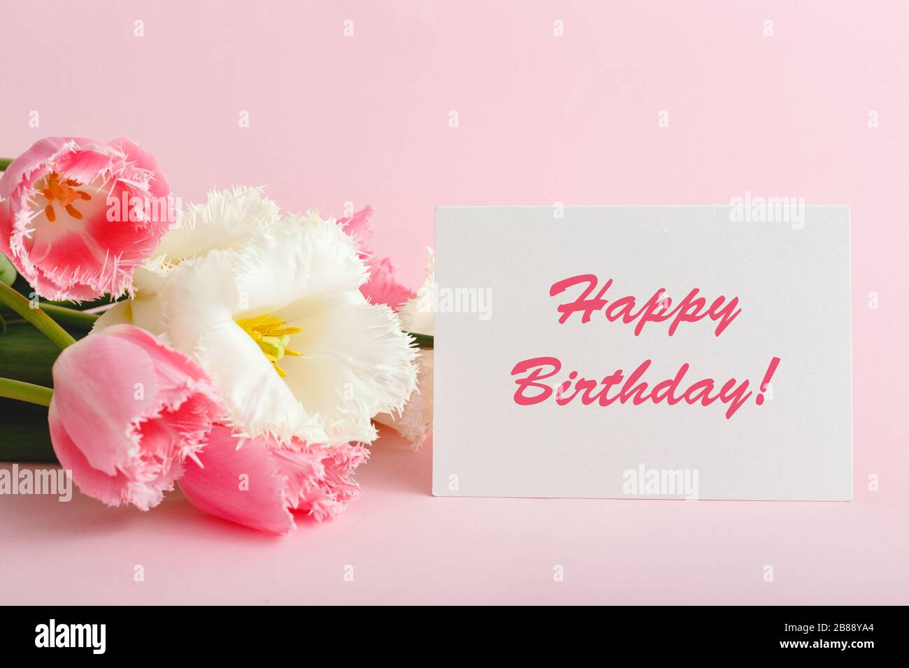 Happy Birthday text on gift card in flower bouquet. Beautiful ...