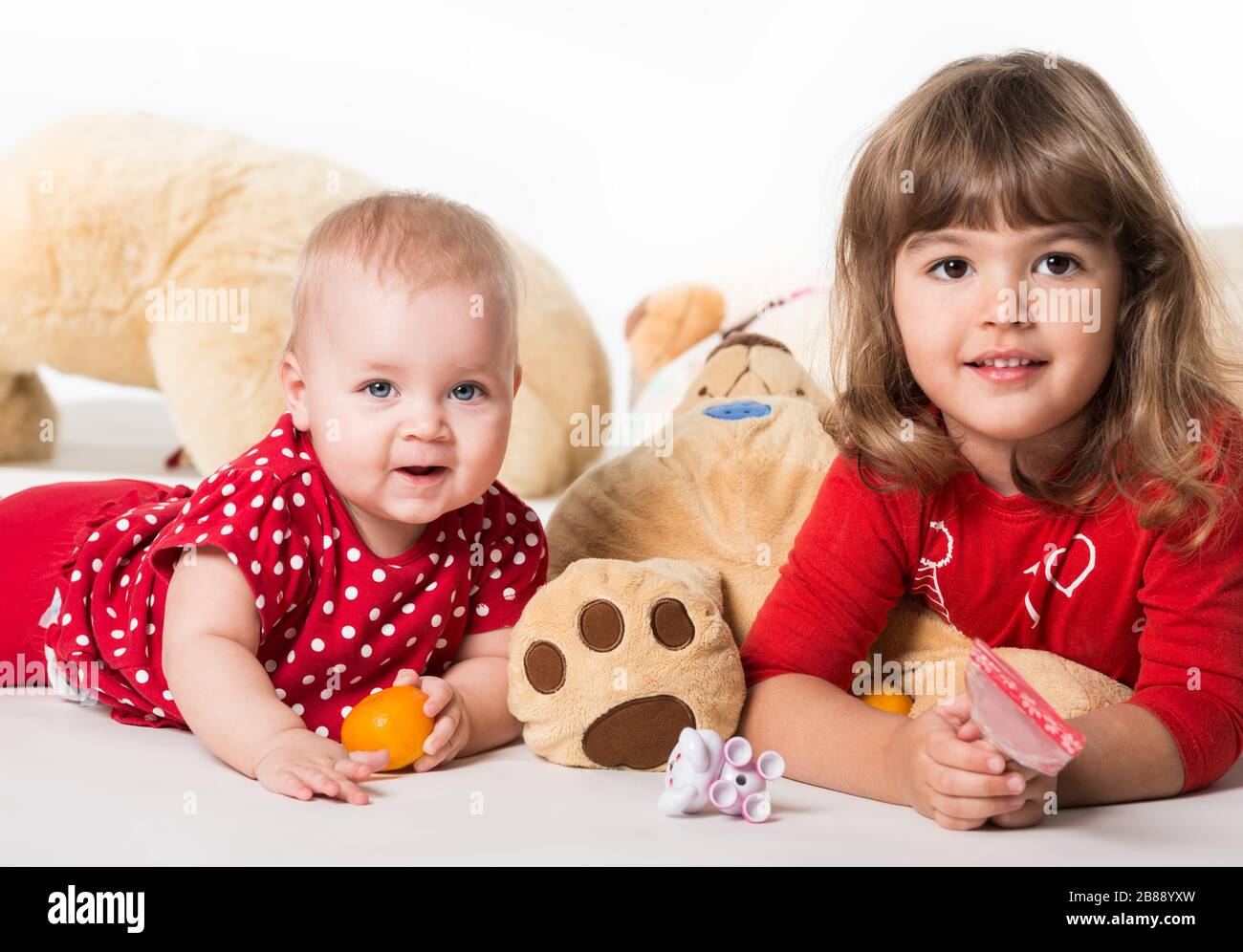 little girls playing with babies