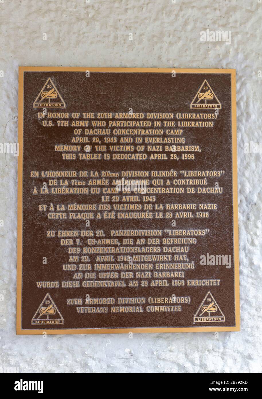 Memorial plaque to the 20th Armored Division liberators at the entrance to the former Nazi German Dachau concentration camp, Munich, Germany. Stock Photo