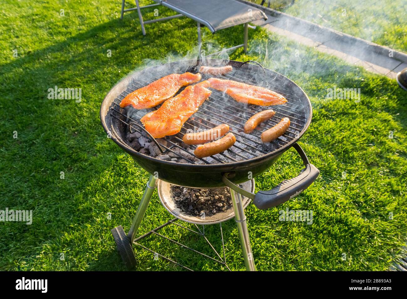 Meat on a charcoal grill at a barbecue Stock Photo - Alamy