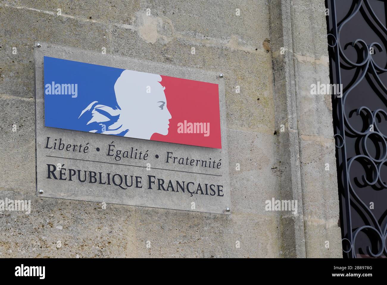 Republique Francaise sign logo France Republic freedom equality fraternity french building state institution stone ancient wall Stock Photo