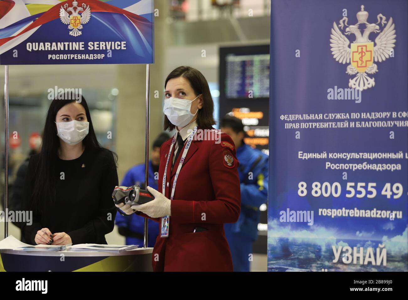An employee of the Russian Federal Service for Surveillance on Consumer Rights Protection and Human Wellbeing (Rospotrebnadzor) is seen at the quarantine desk during the corona pandemic.A special outdoor screening station for COVID-19 coronavirus was opened at Pulkovo airport. At least 253 cases of coronavirus have been confirmed in Russia. Stock Photo