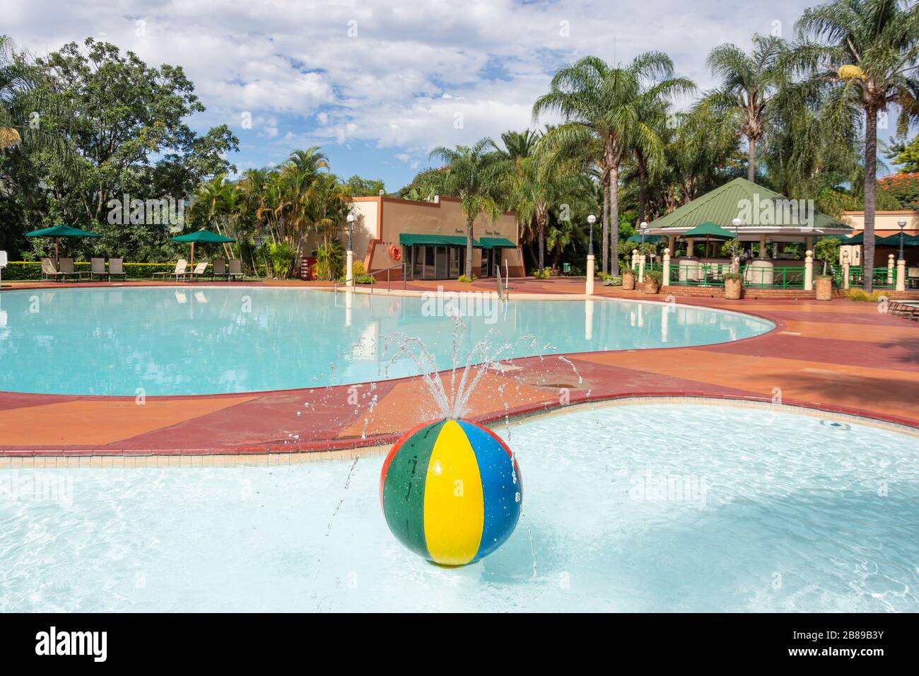 Retro beach ball fountain in Lugogo Sun Hotel swimming pool, Lobamba, Ezulwini Valley, Kingdom of Eswatini (Swaziland) Stock Photo