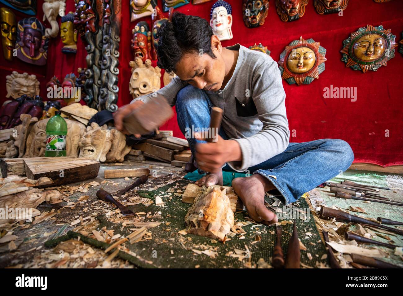 Craftsman making Nepalese masks in Bhaktapur, Nepal Stock Photo