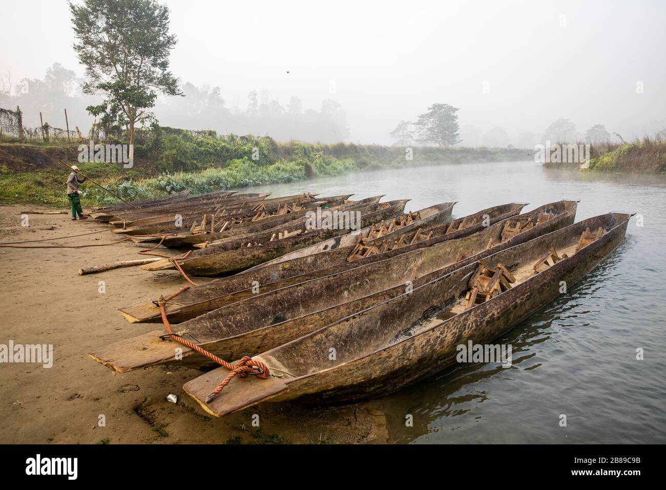 Early morning canoeing on the Narayani Rapti River in Chitwan National Park, Nepal Stock Photo
