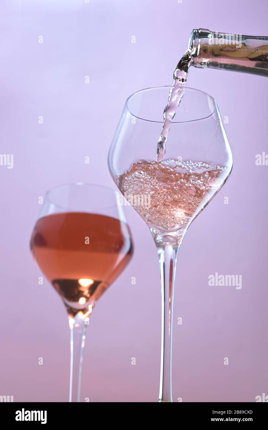 A concept studio image of pouring rose wine into a wine glass Stock ...
