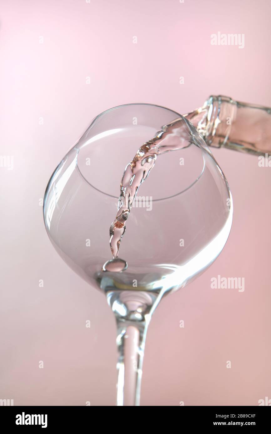 A concept studio image of pouring rose wine into a wine glass Stock ...