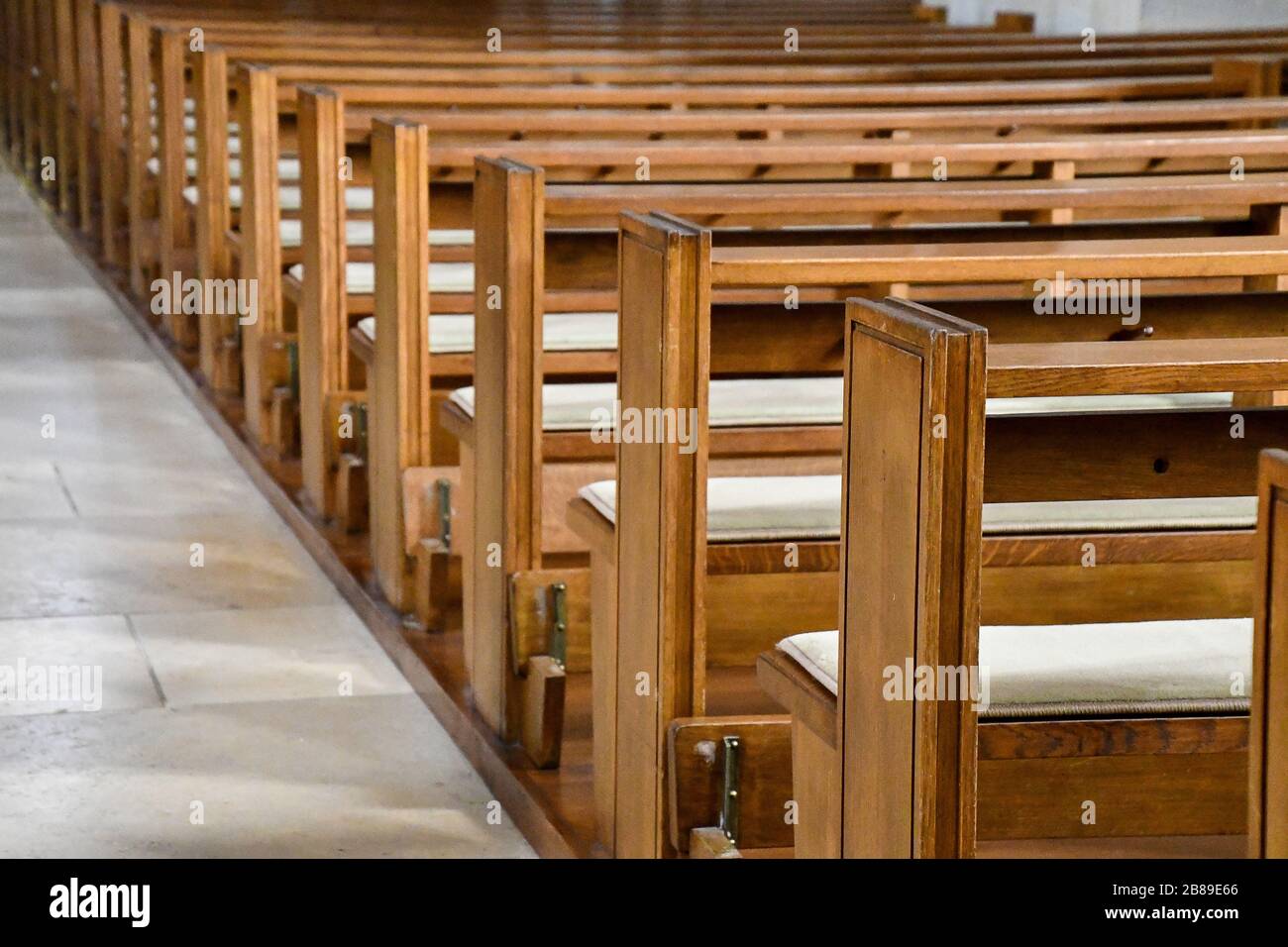 rows of empty pews in church Stock Photo Alamy