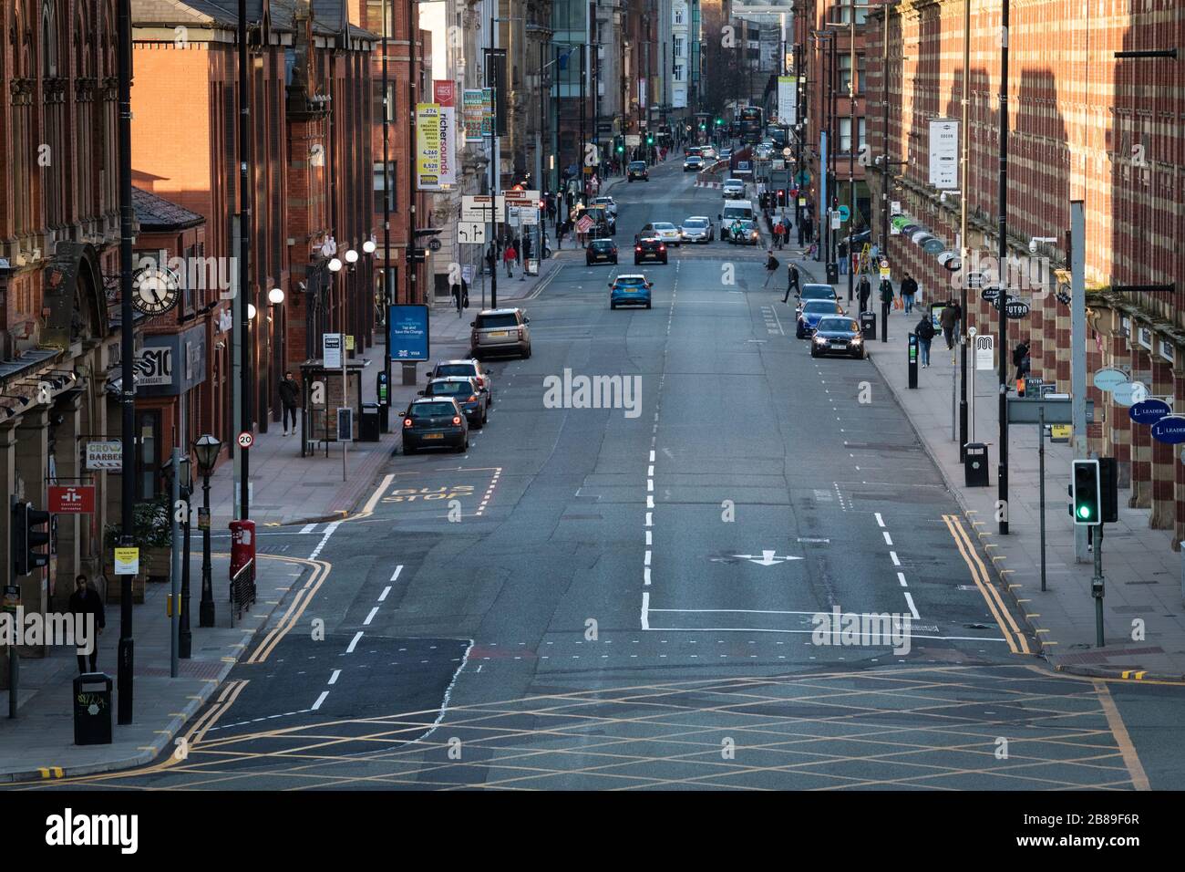 Manchester, UK. 20 March, 2020. Friday evening rush-hour on one of the busiest roads in the city centre is considerably quieter due to the impact of the coronavirus. Credit: Andy Barton/Alamy Live News Stock Photo