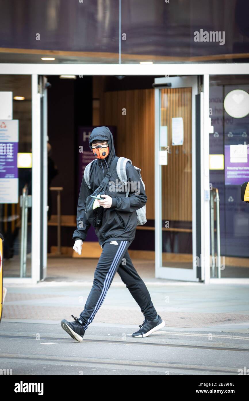 Manchester, UK. 20 March, 2020. UK. A member of the public wears a mask as a precaution against the spread of the coronavirus. Credit: Andy Barton/Alamy Live News Stock Photo