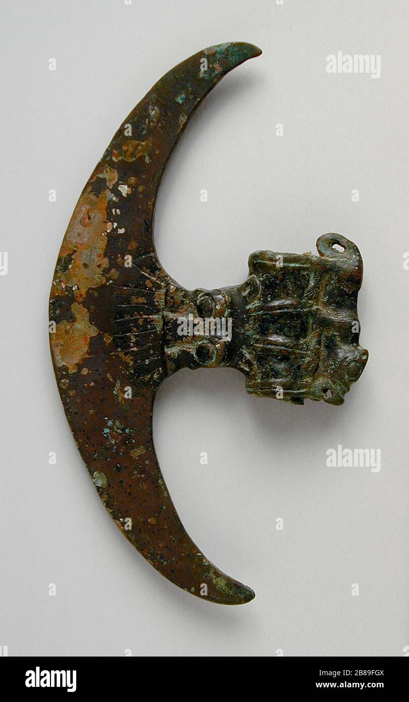 'Axe with Animal and Tiger Masks; English:  China, Luristan bronzes, Han dynasty, 206 B.C.-A.D. 220 Arms and Armor; axes Cast bronze Gift of Carl Holmes (64.12.52) Chinese Art; 206 B.C.-A.D. 220; ' Stock Photo