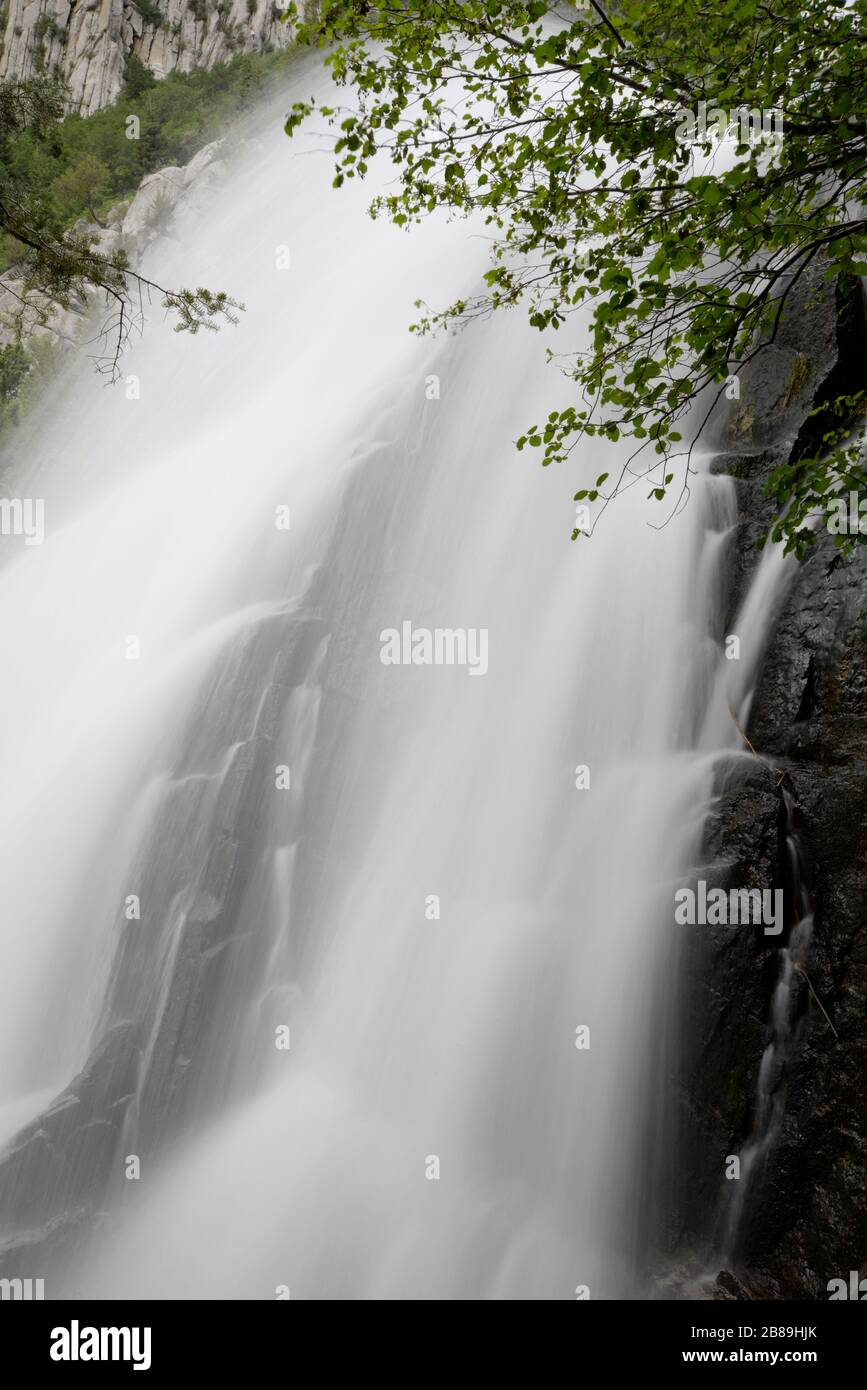 Flowing water blurs in intimate view of Bells Canyon waterfall. Stock Photo