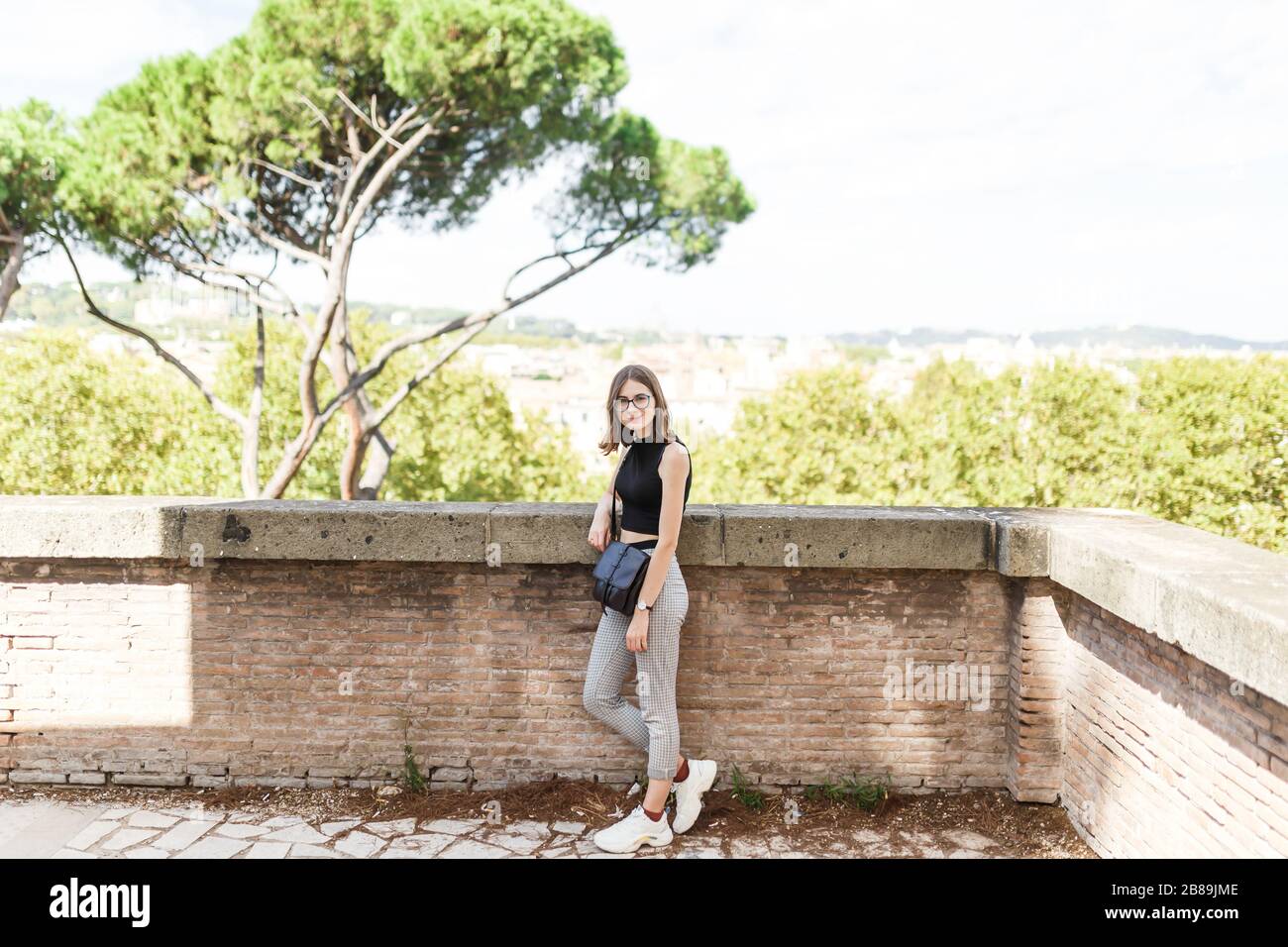 young tourist walks the streets of Rome in summer Stock Photo