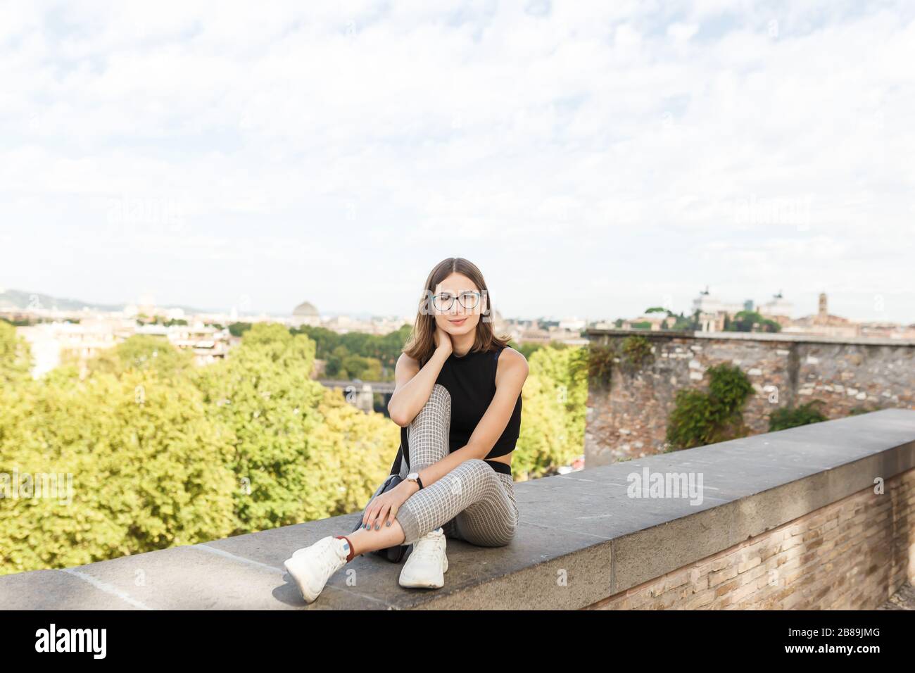 young tourist walks the streets of Rome in summer Stock Photo