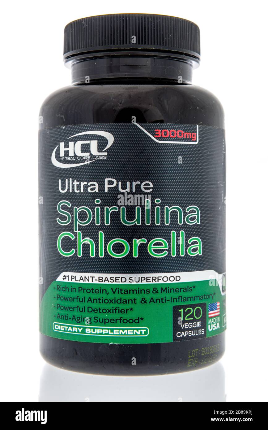 Winneconne,  WI - 12 March 2020:  A bottle of HCL herbal code labs ultra pure spirulina  on an isolated background. Stock Photo
