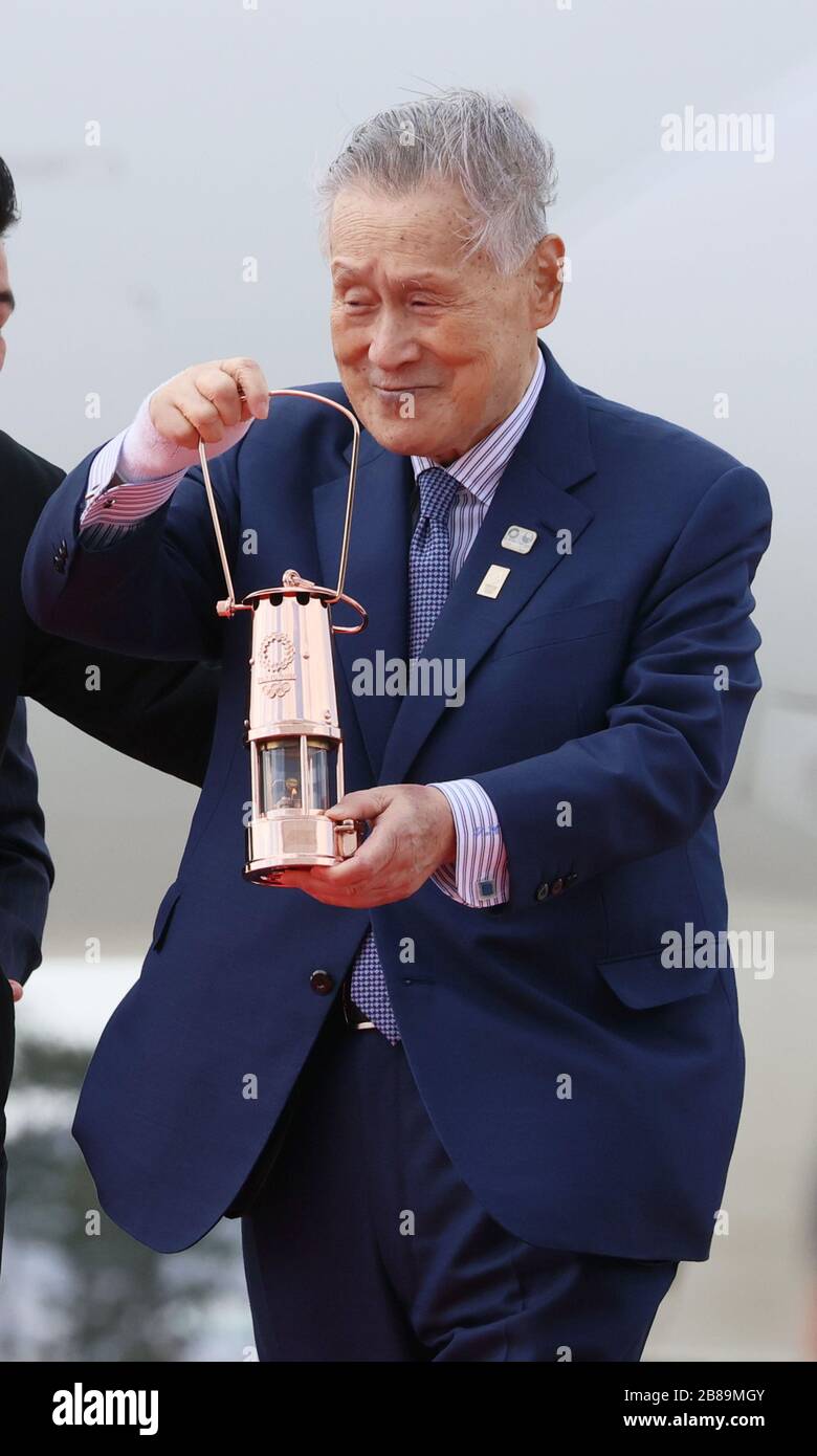 Higashi Matsushima, Japan. 20th Mar, 2020. Tokyo 2020 Olympics organizing committee president Yoshiro Mori holds a lantern as he attends the arrival ceremony for the Olympic flame at the Matsushima air base in Higashi Matsushima in Miyagi prefecture, northern Japan on Friday, March 20, 2020. Tokyo 2020 Olympic Games will start from March 26 at Fukushima prefecture. Credit: Yoshio Tsunoda/AFLO/Alamy Live News Stock Photo