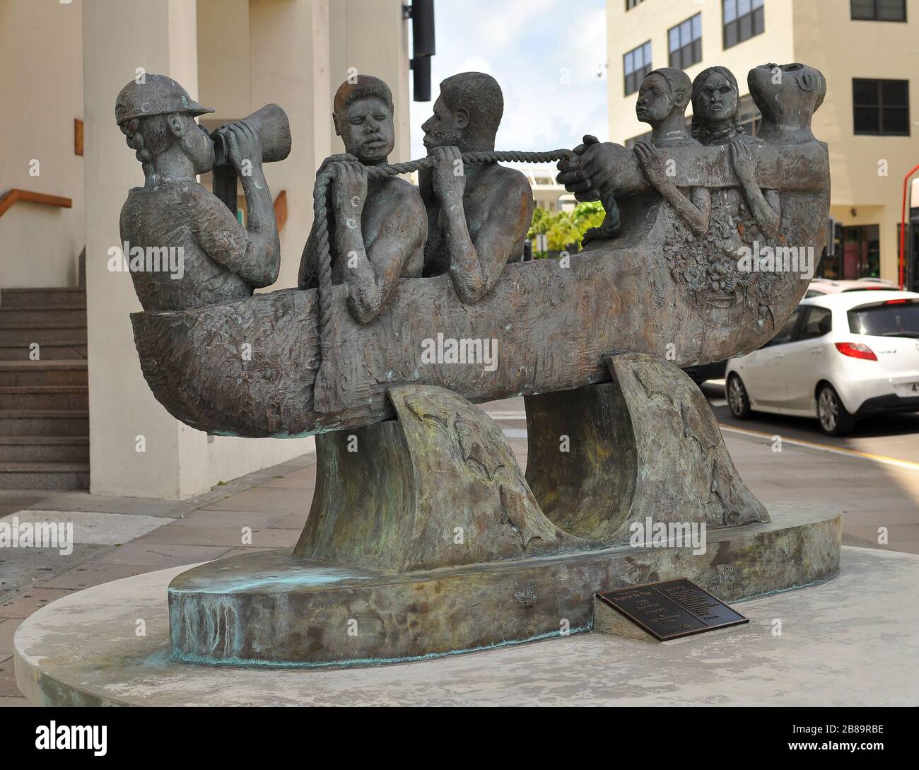 Bronze Sculpture Against da Tide the work of Bermudian Sculptor Bill Ming.Figurative sculpture of six 6 men in a small boat, 6 feet long, 4 feet high. Stock Photo