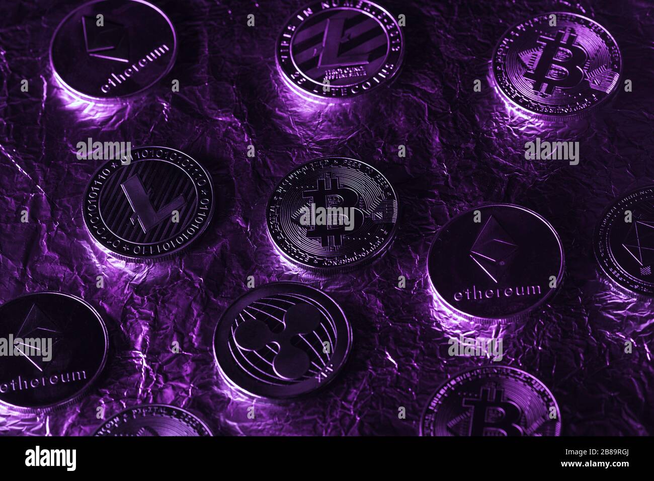 Bitcoin with purple light. The rise and fall of cryptocurrency. The world  crisis Stock Photo - Alamy