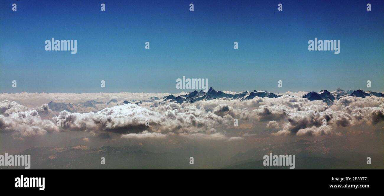 , Mont Blanc mountain above the clouds in the French Alps, 19.04.2011, aerial view, Savoie, Haute-Savoie, Saint-Gervais-les-Bains Stock Photo