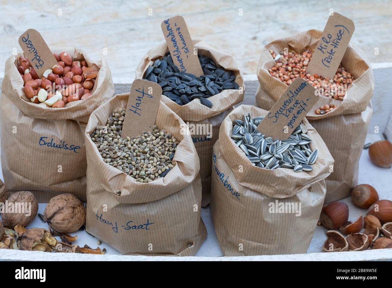 ingredients for mixed birdseeds: peanuts, great millet, sunflower seeds, walnuts and Hazelnuts, Germany Stock Photo