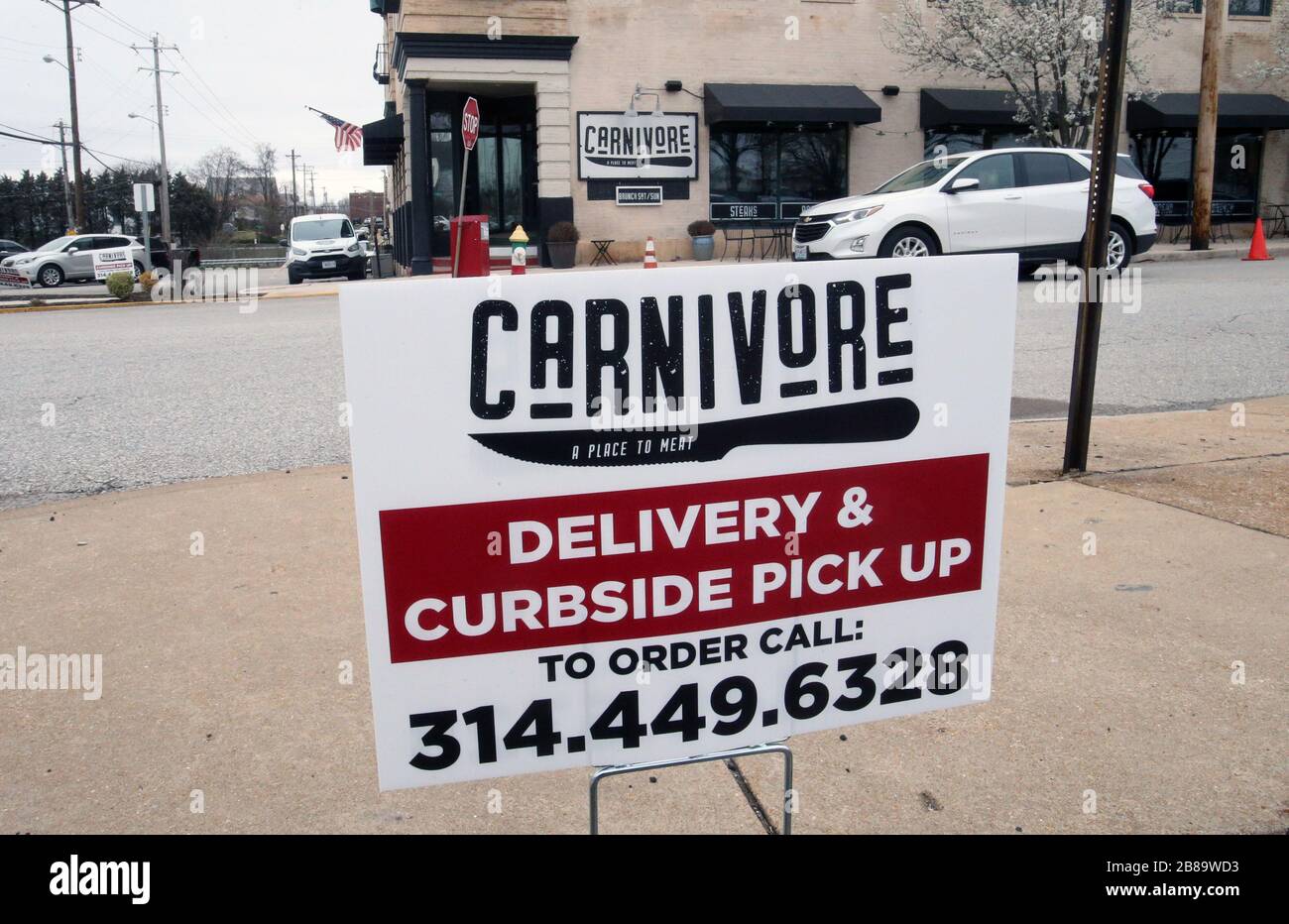 St. Louis, USA. 20th Mar, 2020. Signs on a street corner tells people