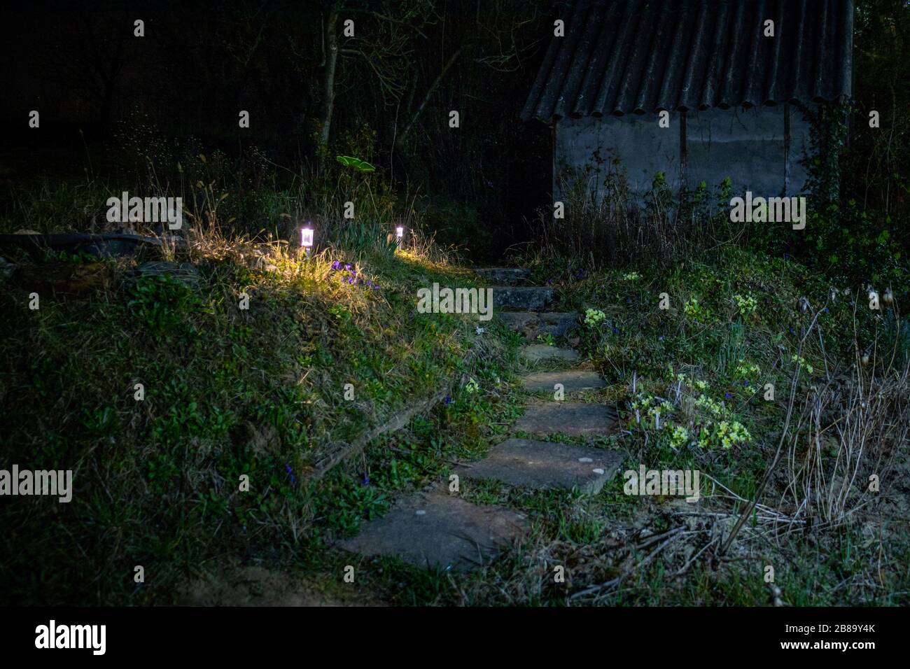 Shed at night with torches Stock Photo