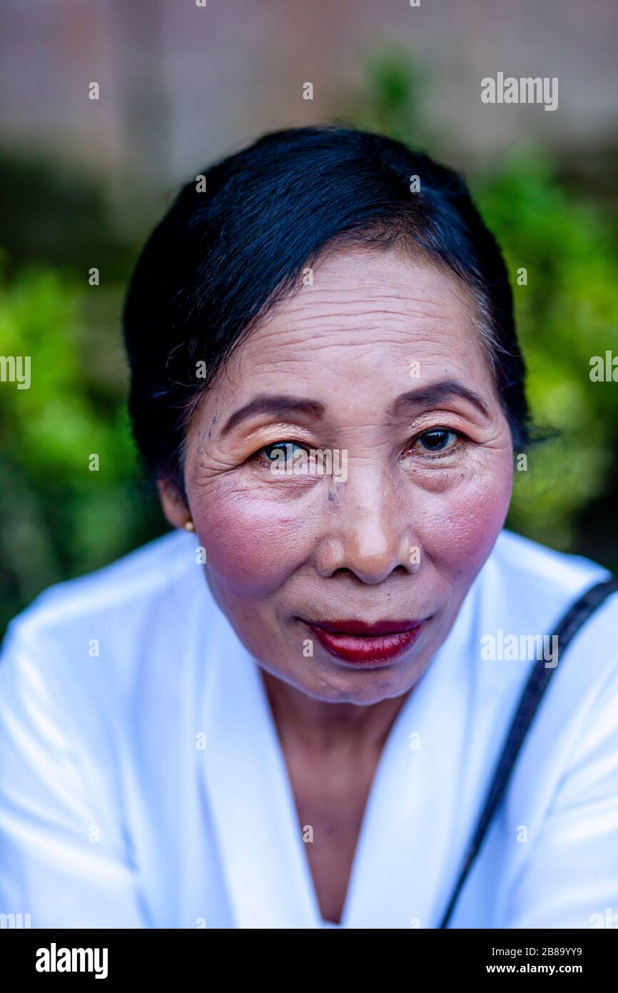 A Portrait Of A Balinese Hindu Woman At The Tirta Empul Water Temple, Bali, Indonesia. Stock Photo