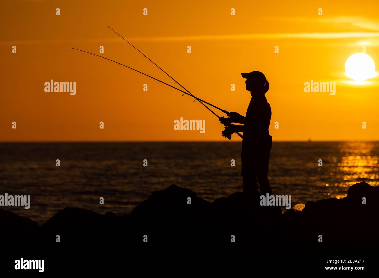 Two boys fishing coast hi-res stock photography and images - Alamy