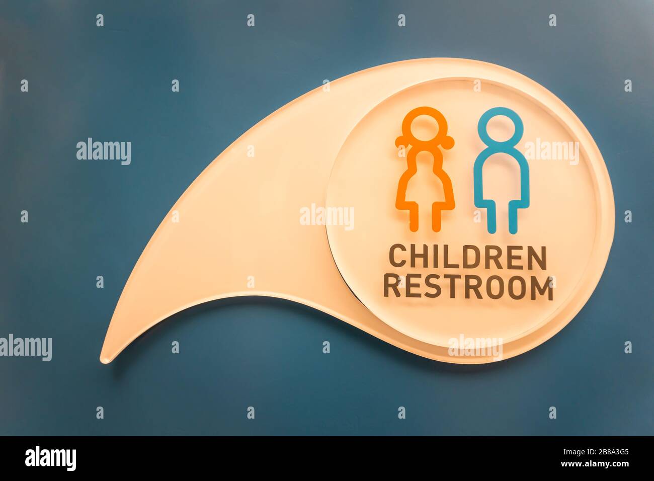Children's bathroom symbol on white and blue wall background Stock ...