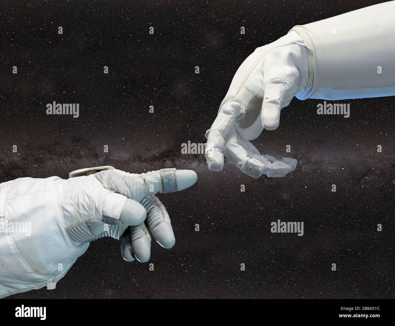 Astronaut and robotic hand in contact. Elements of this image furnished by NASA. Stock Photo