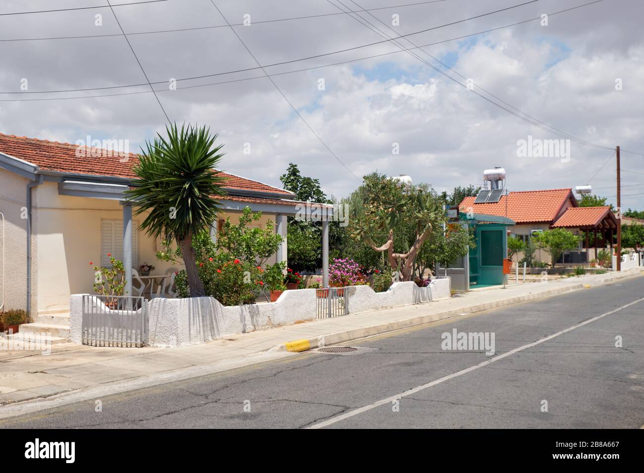The view of residential houses on the quiet street of Livadia village. Larnaca. Cyprus Stock Photo
