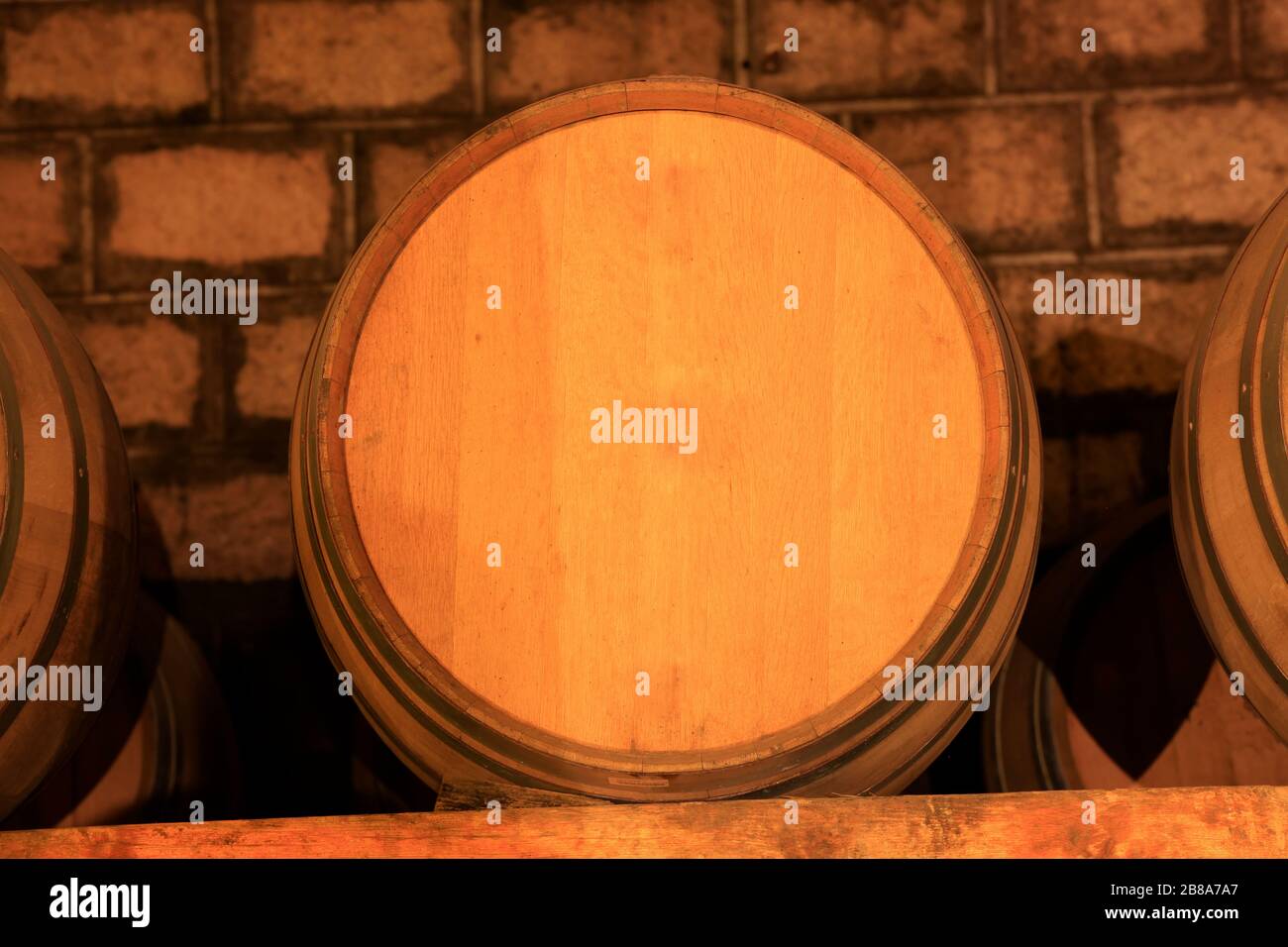 Wine barrels stacked in the cellar of the winery Stock Photo - Alamy