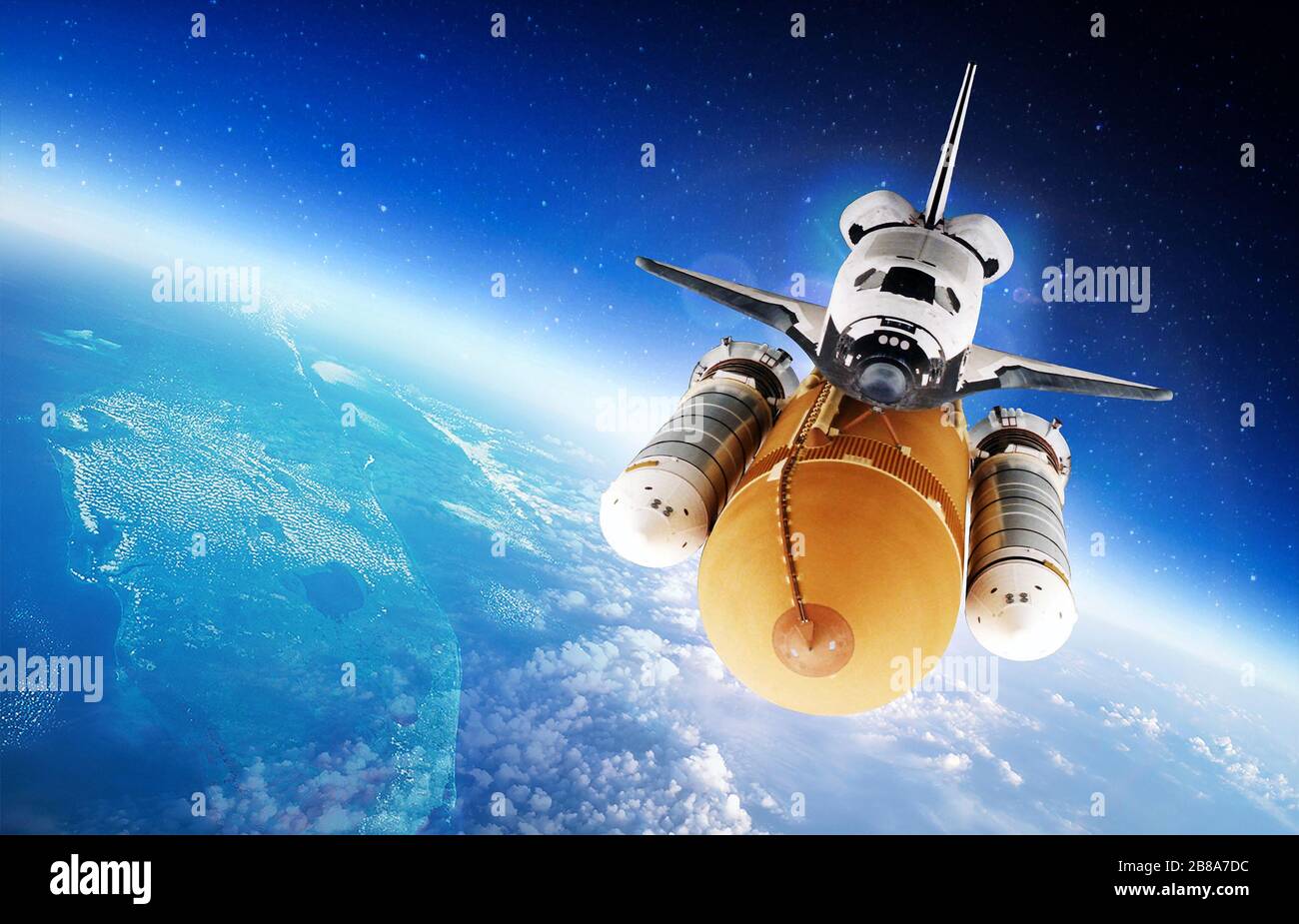 Space Shuttle orbiting the earth. Elements of this image furnished by NASA. Stock Photo