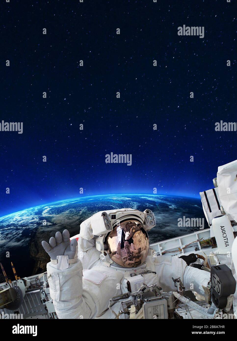 Astronaut on space mission with earth on the background. Elements of this image furnished by NASA. Stock Photo