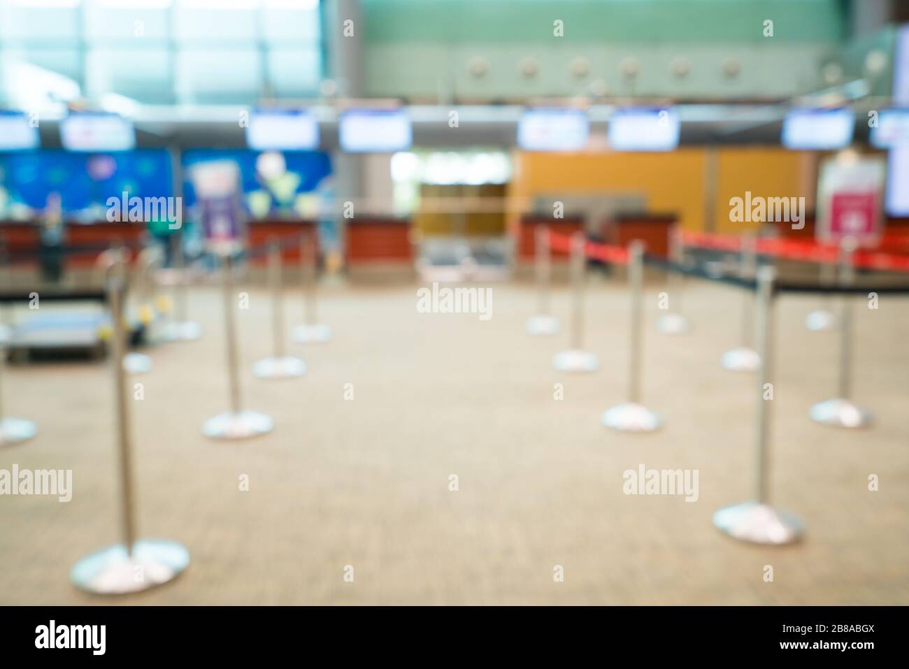 Airport check-in desk blurred background defocused. Empty check-in counter. Stock Photo