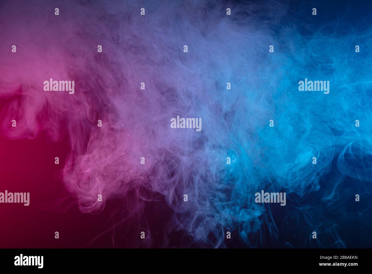 Blue and pink bomb smoke on black isolated background Stock Photo - Alamy