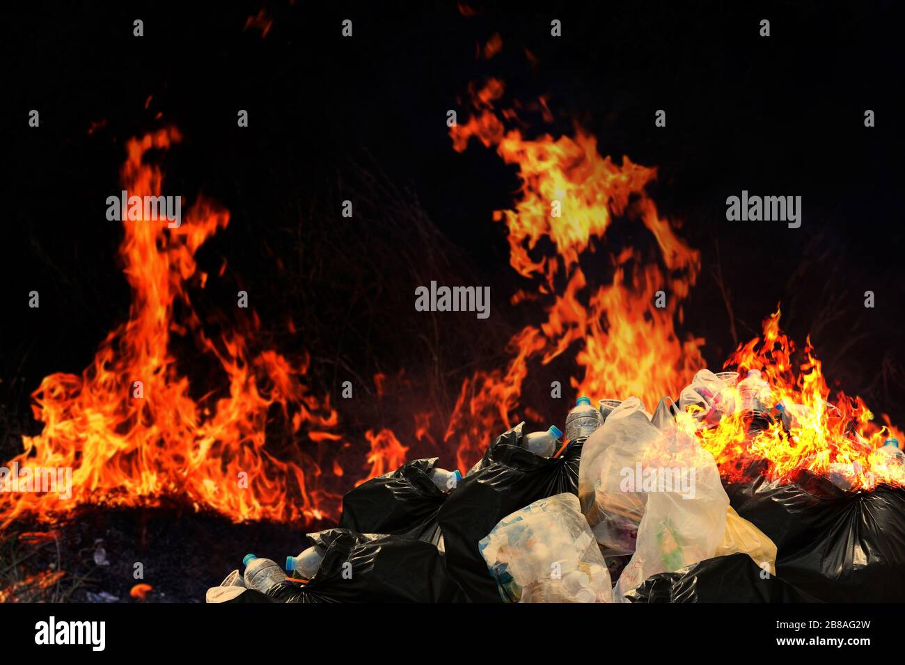 Burn a lot of waste plastic garbage, Garbage bin pile Dump Lots of junk Polluting with Plastic Burning heap of smoke from a burning pile of many garba Stock Photo