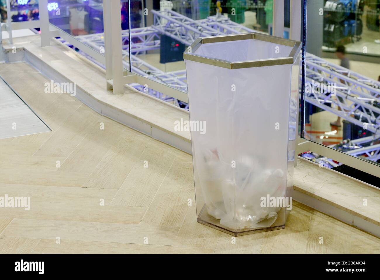 bin clear plastic trash in the mall, waste plastic bin on floor shopping mall inside Stock Photo