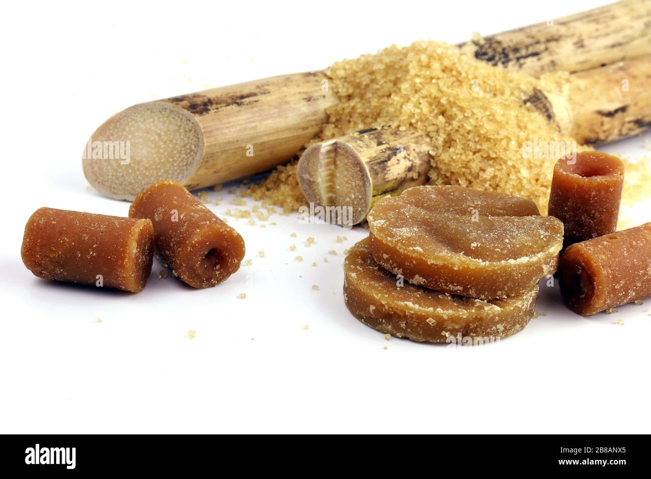 Sugarcane and pile Granulated Sugar reed solid, Cane, Sugar reed solid concentrate, Sugar cubes brown from Sugarcane and various kinds of sugar brown Stock Photo